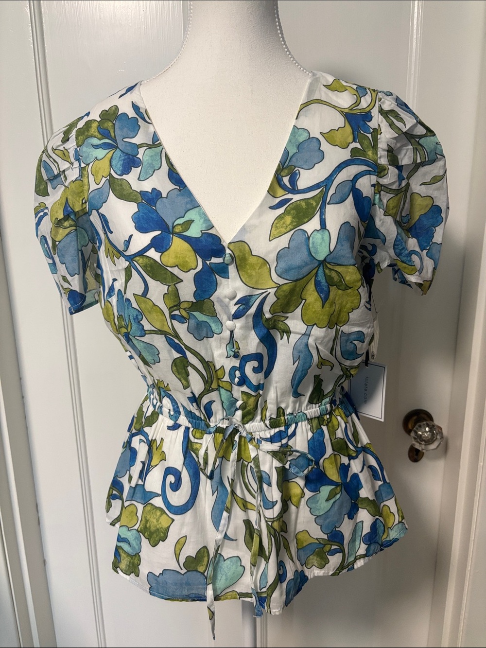 1. State White Floral V-Neck Peplum Blouse with Blue & Green Print
